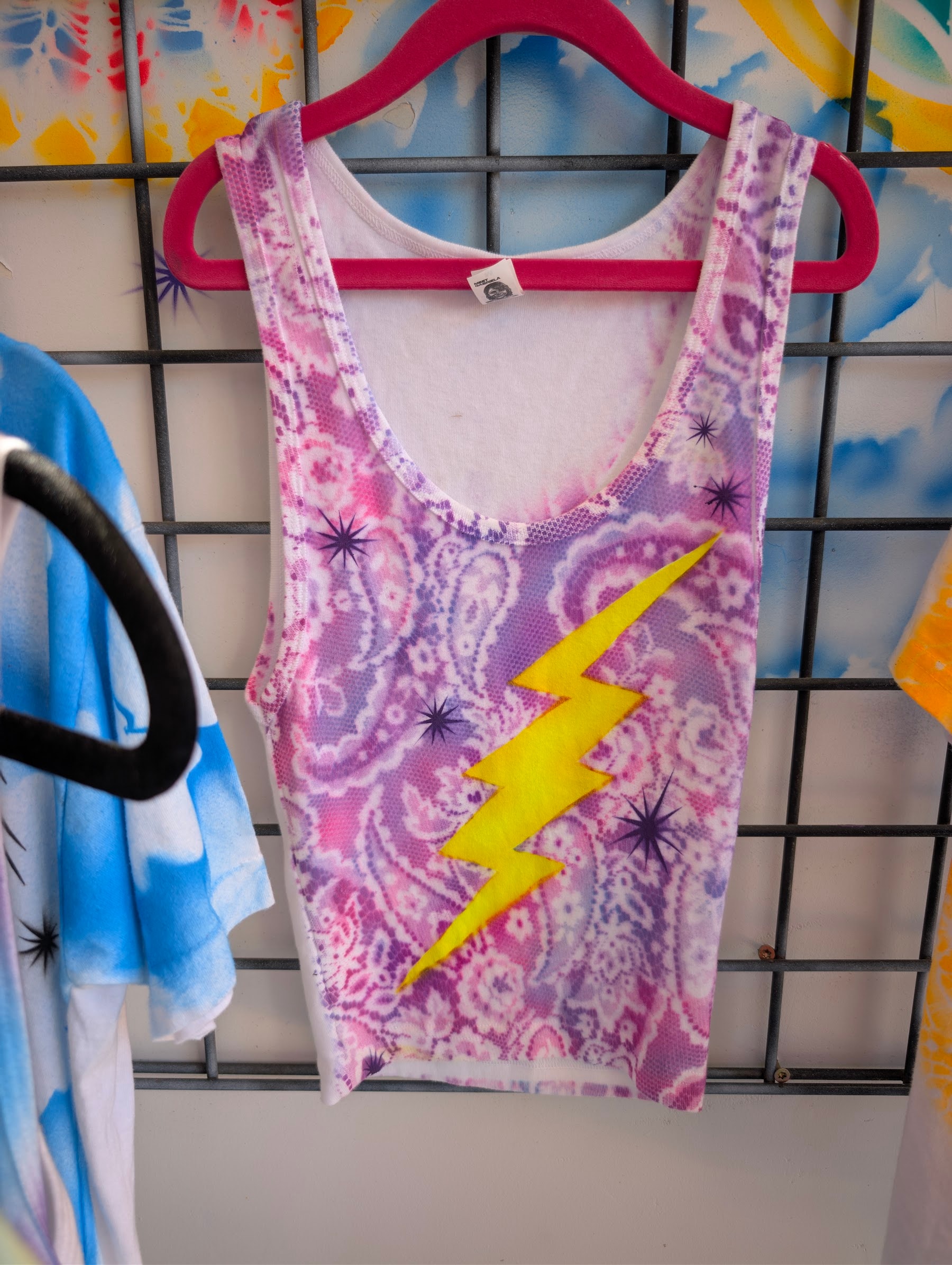 Purple hand-airbrushed tank top with a yellow lightning bolt by Star Shields