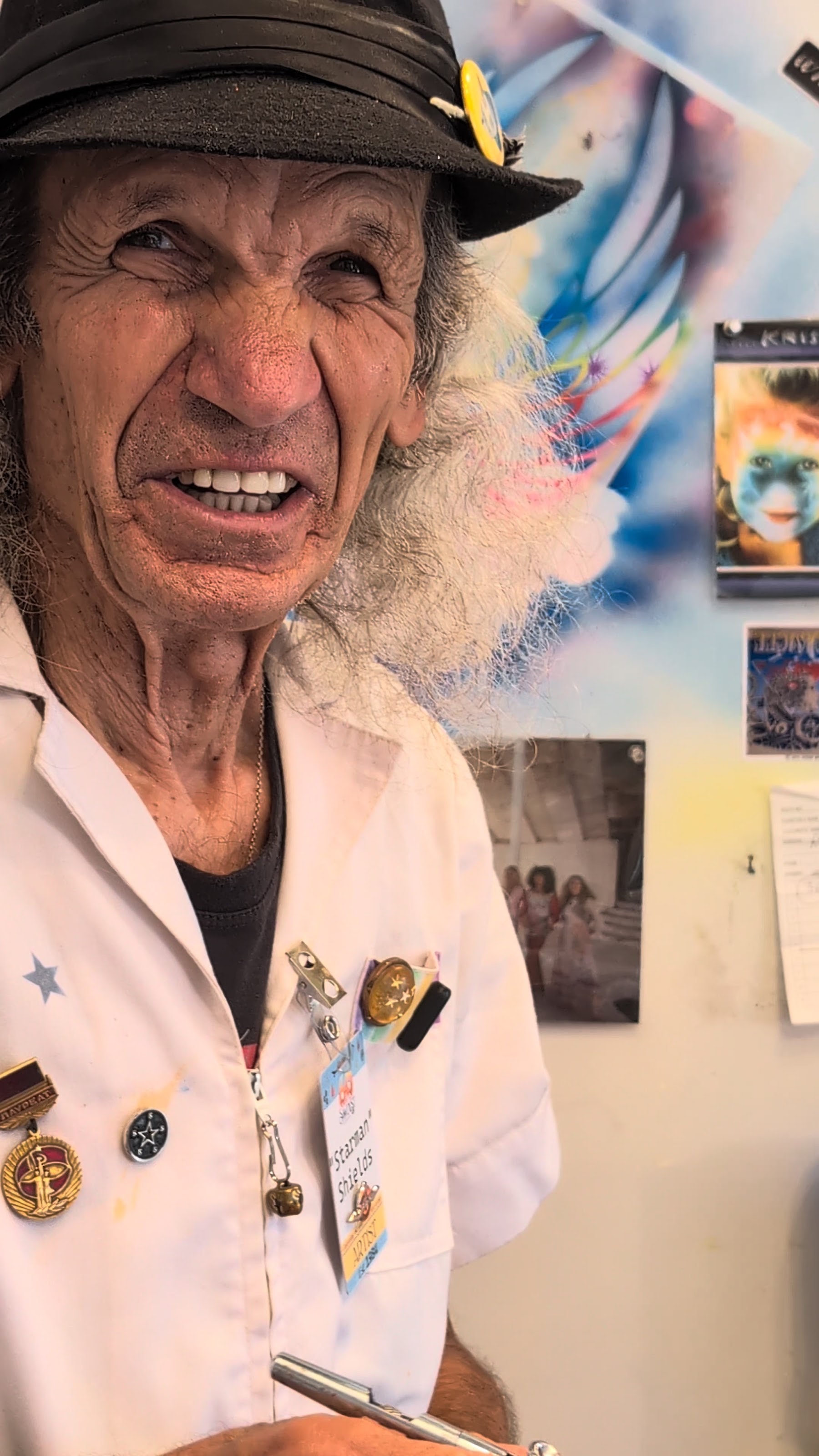 Star Shields smiling in his Laguna Beach art booth